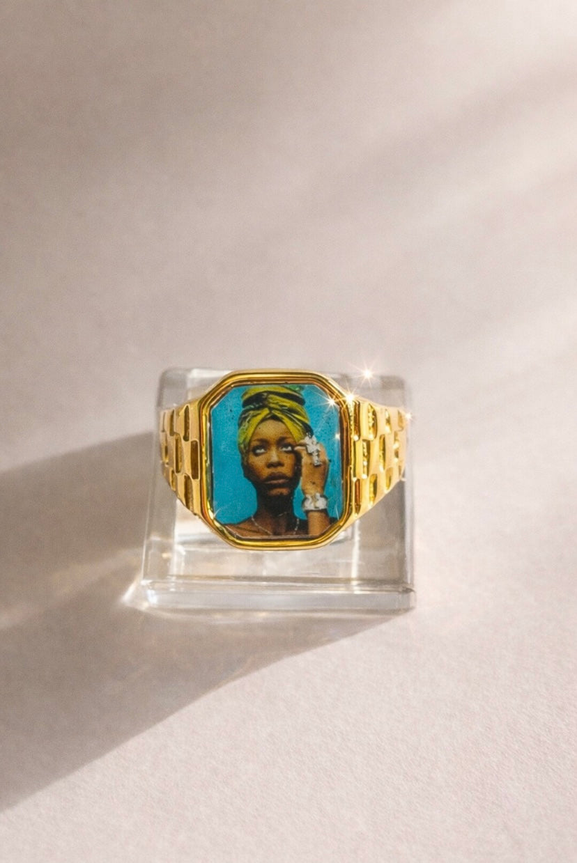 18K gold-plated Erykah Badu-inspired Lav Vintage promise ring with square face, photographed on a neutral background.
