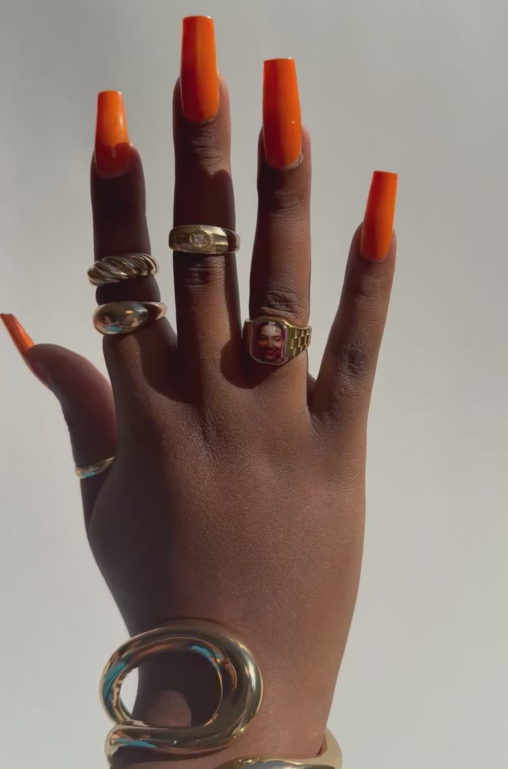 Video  wearing stacked gold rings including an Olivia Dean-inspired Lav Vintage promise ring, styled in natural sunlight.
