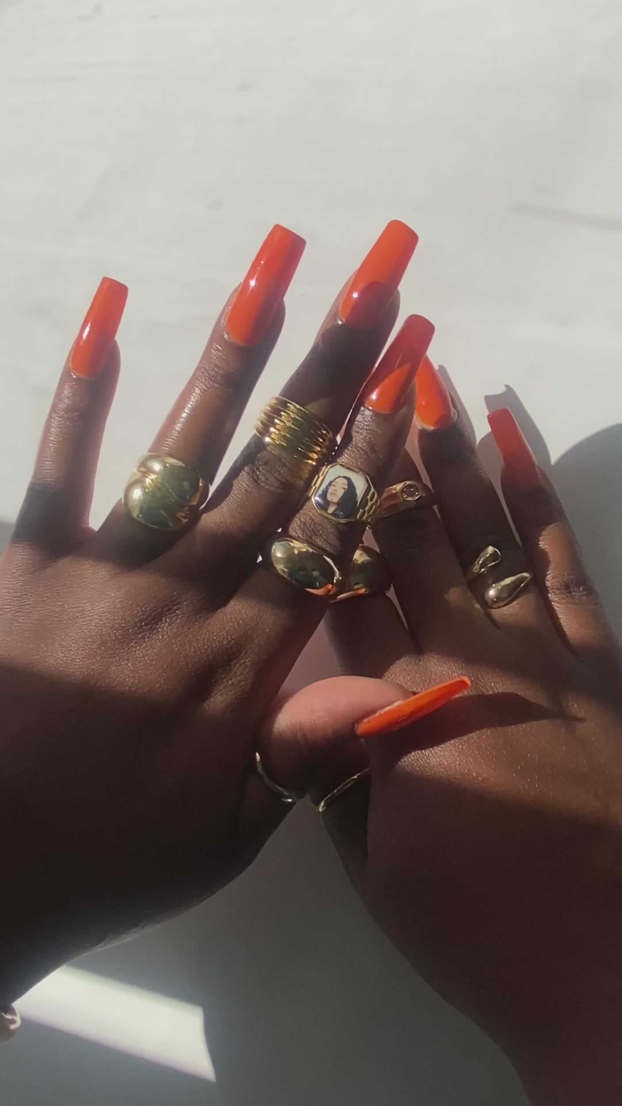 Video showing hand wearing stacked gold rings including a Cleo Sol-inspired Lav Vintage promise ring, styled in natural sunlight.
